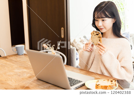 College student enjoying videos on laptop College student enjoying videos on laptop 120402388
