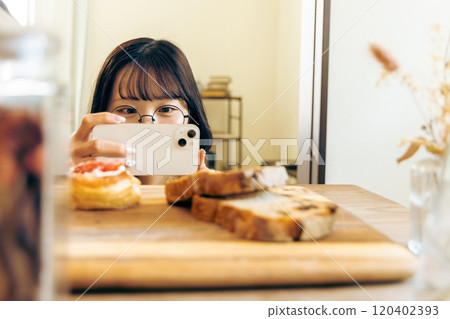 Young woman taking glorious photos Young woman taking glorious photos 120402393