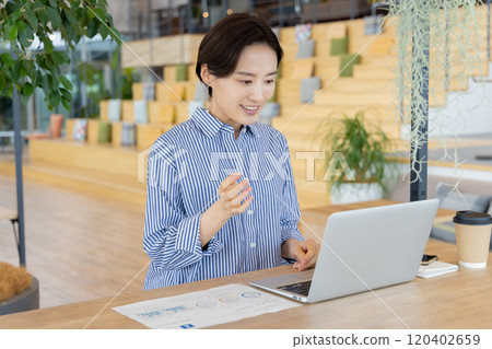 A woman working in a designer's office 120402659