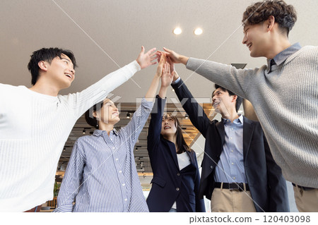 A circle of people working in a fashionable designer's office A circle of people working in a fashionable designer's office 120403098