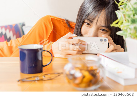 Young woman taking glorious photos Young woman taking glorious photos 120403508