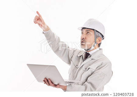 Businessman in work clothes with a laptop 120403728