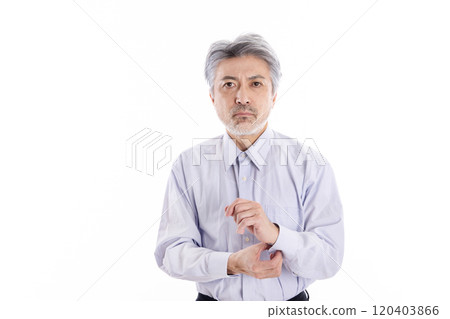 Business man buttoning his shirt 120403866
