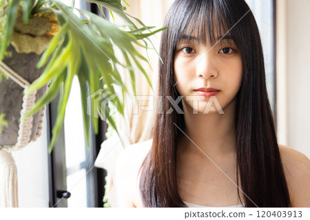 Young woman in camisole 120403913