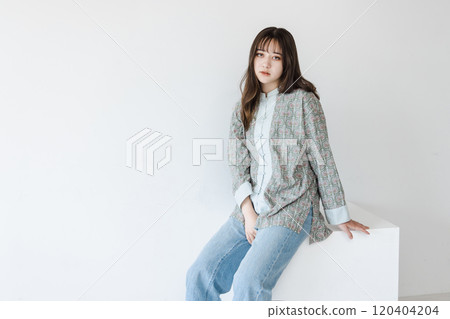 Half woman sitting on a white block Half woman sitting on a white block 120404204