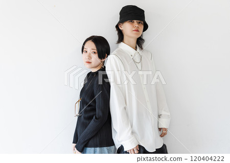 Fashionable young men and women back to back Fashionable young men and women back to back 120404222