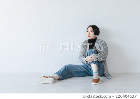 Young woman sitting on physical education Young woman sitting on physical education 120404527