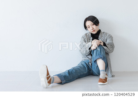 Young woman sitting on physical education Young woman sitting on physical education 120404529