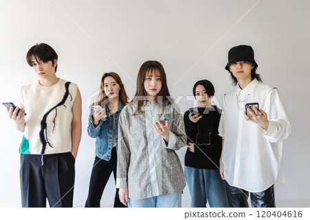 Generation Z men and women using smartphones Generation Z men and women using smartphones 120404616