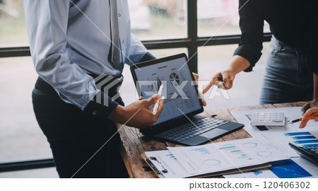 Fund managers team consultation and discuss about analysis Investment stock market at office 120406302