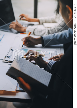 Fund managers team consultation and discuss about analysis Investment stock market at office 120406315