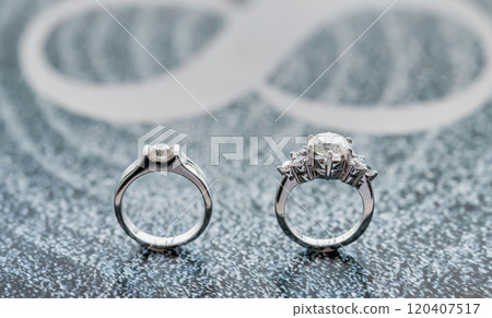 Closeup wedding diamond rings for him and her Closeup wedding diamond rings for him and her 120407517