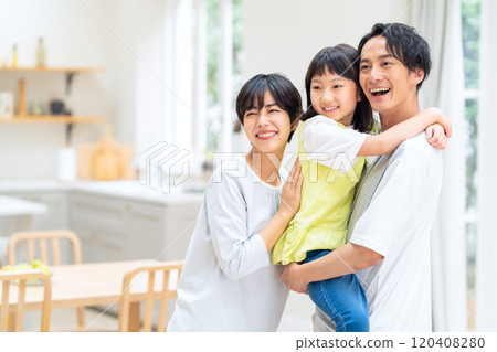 A family relaxing in the living room 120408280