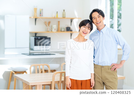 A young couple relaxing in the living room A young couple relaxing in the living room 120408325