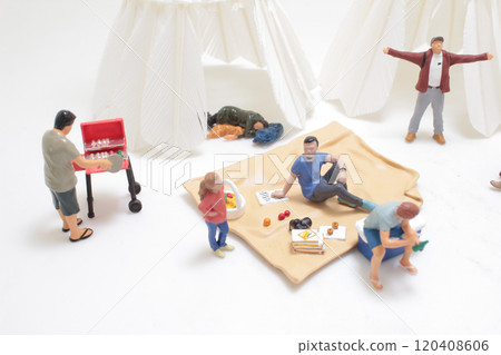 Miniature Campers Gathering Around a Campfire Near Teepees Miniature Campers Gathering Around a Campfire Near Teepees 120408606