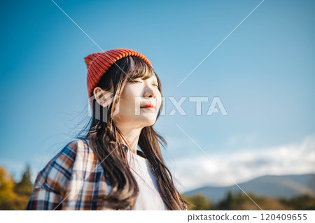 young woman looking up at the sky young woman looking up at the sky 120409655
