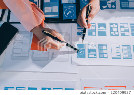 Young Asian business creative team work together, mobile application software design project. Brainstorm meeting, internet technology, smartphone web app designer, office coworker teamwork concept 120409927