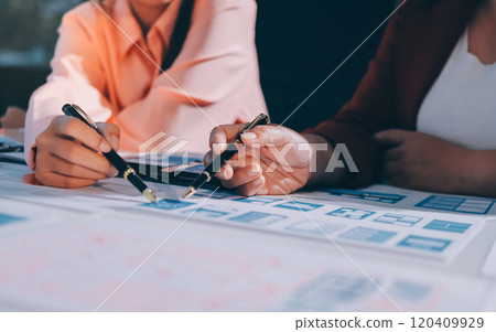 Young Asian business creative team work together, mobile application software design project. Brainstorm meeting, internet technology, smartphone web app designer, office coworker teamwork concept 120409929