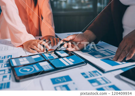 Young Asian business creative team work together, mobile application software design project. Brainstorm meeting, internet technology, smartphone web app designer, office coworker teamwork concept Young Asian business creative team work together, mobile application software design project. Brainstorm meeting, internet technology, smartphone web app designer, office coworker teamwork concept 120409934