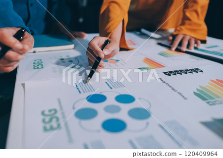 ESG environmental social governance display on laptop on eco-friendly company meeting with business people implementing environmental protection for clean and sustainable future ecology. Trailblazing ESG environmental social governance display on laptop on eco-friendly company meeting with business people implementing environmental protection for clean and sustainable future ecology. Trailblazing 120409964