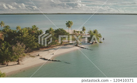 Aerial drone fly over tropical island beach with white sand, palm trees and crystal sea water. Maupiti, French Polynesia. Remote wild nature place to visit, exotic summer vacation, travel background Aerial drone fly over tropical island beach with white sand, palm trees and crystal sea water. Maupiti, French Polynesia. Remote wild nature place to visit, exotic summer vacation, travel background 120410371