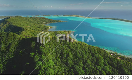 Tropical green mountain Bora Bora island, aerial view. Drone fly over forest coastline with turquoise water, showcasing beauty and tranquility of exotic wild nature. Summer luxury travel background 120410390