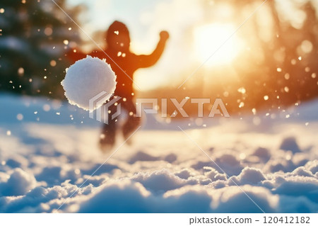 Excited Child Tossing Snowball in Beautiful Snowy Setting 120412182