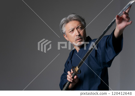 Senior man with a sword Senior man with a sword 120412648