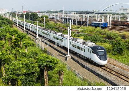 Pingtung, Taiwan: November 5, 2023: A Tze-Chiang Limited Express train(EMU3000 series) passes through Chaozhou of Pingtung, Taiwan. 120412956