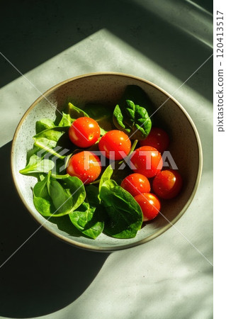 Close-up of Seasoned Cherry Tomatoes and Spinach 120413517