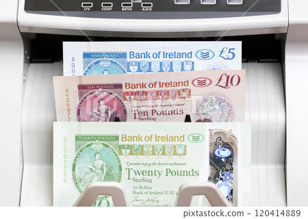 Irish pound in the counting machine Irish pound in the counting machine 120414889