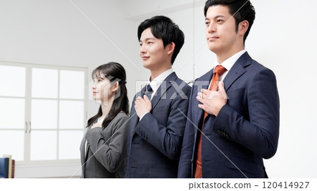 Business person with hand on chest 120414927