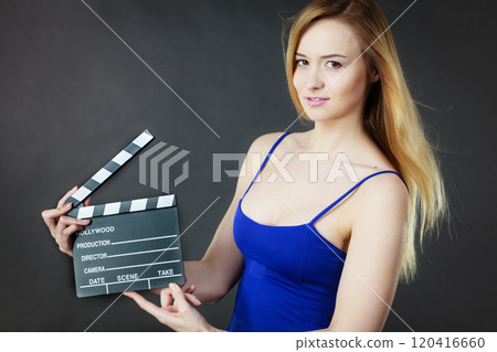 Woman holding professional film slate Woman holding professional film slate 120416660