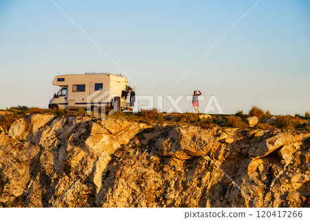 Camper camping on cliff rock, Spain 120417266