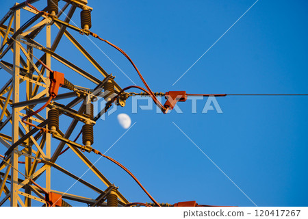 High voltage towers against blue sky 120417267