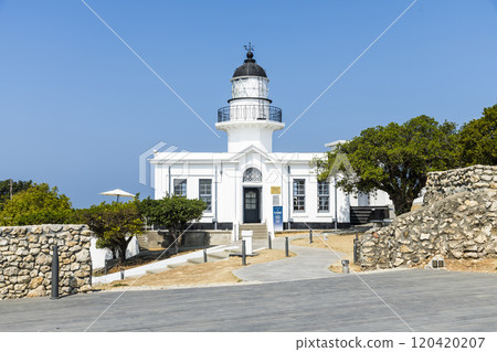 Close-up of Cihou Lighthouse with a blue sky background in Kaohsiung, Taiwan. Close-up of Cihou Lighthouse with a blue sky background in Kaohsiung, Taiwan. 120420207