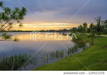 Sunset over lake water in southern tropical wetlands. Amazing Florida nature Sunset over lake water in southern tropical wetlands. Amazing Florida nature 120421358