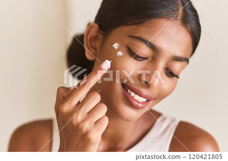 Face Skincare. Woman Applying Face Cream Skincare With Joyful Expression Face Skincare. Woman Applying Face Cream Skincare With Joyful Expression 120421805