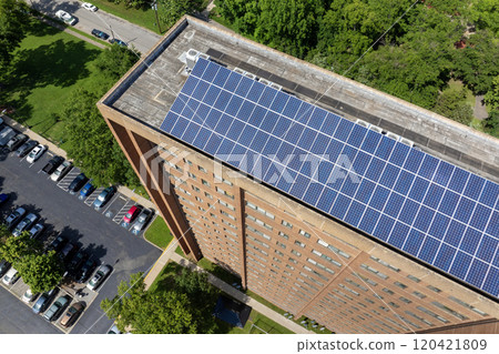 Photovoltaic panels for producing clean ecological electric energy. Residential apartment building with solar roof. Renewable electricity with zero emission concept 120421809