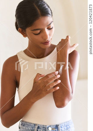 Woman Applying Moisturizing Cream on Arm for Skincare Routine Woman Applying Moisturizing Cream on Arm for Skincare Routine 120421873