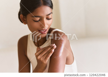 Woman Applying Moisturizing Lotion for Healthy Glowing Skin Woman Applying Moisturizing Lotion for Healthy Glowing Skin 120422046