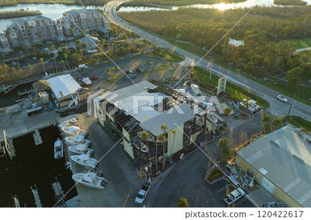Hurricane Ian destroyed boat station in Florida coastal area. Natural disaster and its consequences 120422617