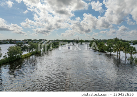 Hurricane flooded car on city street in surrounded with water Florida residential area. Consequences of hurricane Debby natural disaster Hurricane flooded car on city street in surrounded with water Florida residential area. Consequences of hurricane Debby natural disaster 120422636