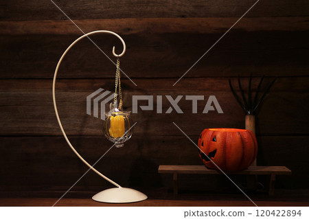 Halloween pumpkin and candle light with dark grunge wooden background 120422894