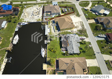 Damaged waterfront houses after hurricane Ian in Florida residential area. Consequences of natural disaster Damaged waterfront houses after hurricane Ian in Florida residential area. Consequences of natural disaster 120423175