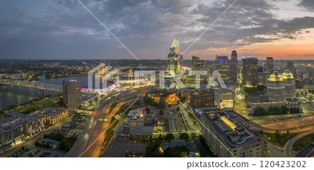 Cincinnati Ohio USA night urban landscape. Downtown district skyline with brightly illuminated high skyscraper buildings in modern American megapolis Cincinnati Ohio USA night urban landscape. Downtown district skyline with brightly illuminated high skyscraper buildings in modern American megapolis 120423202