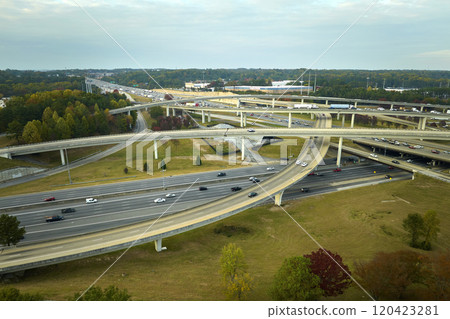 American freeway intersection with fast driving cars and trucks. View from above of USA transportation infrastructure 120423281