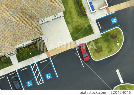Aerial view of cars parked on parking places at american apartment building in Florida residential area. New family condos as example of housing development in US suburbs 120424046