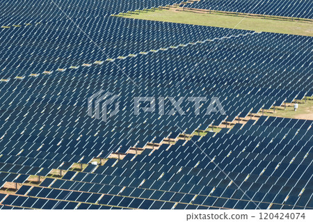 Aerial view of big sustainable electric power plant with many rows of solar photovoltaic panels for producing clean electrical energy. Renewable electricity with zero emission concept 120424074