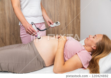 Using a fetal Doppler to monitor the heartbeat of a baby during prenatal care Using a fetal Doppler to monitor the heartbeat of a baby during prenatal care 120424892